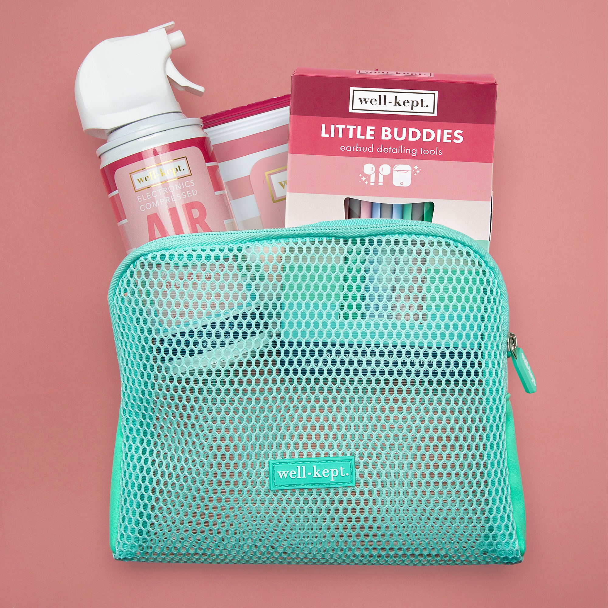 A Mesh Tech Pouch with cleaning products and a "Little Buddies" box displayed against a pink background.