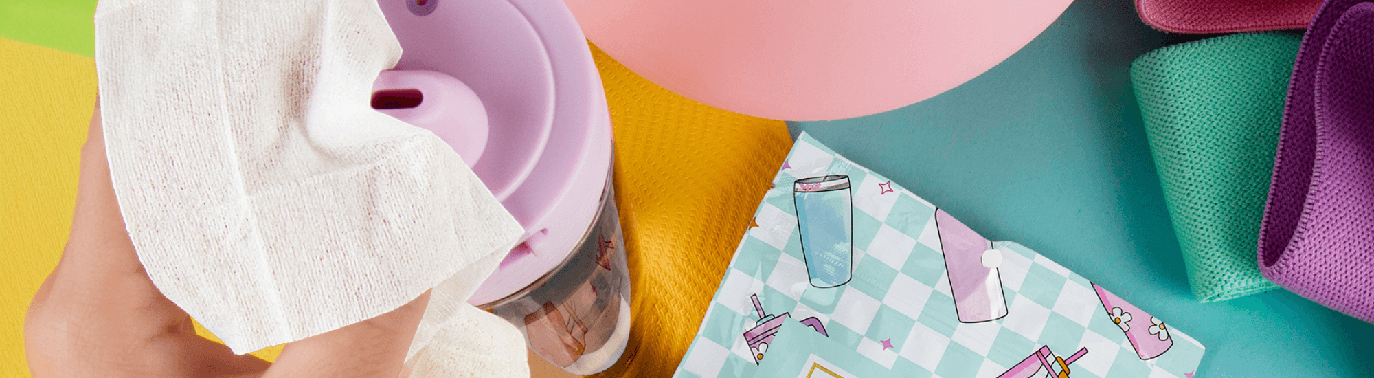 Image of hand wiping off tumbler with Well-Kept wipes.