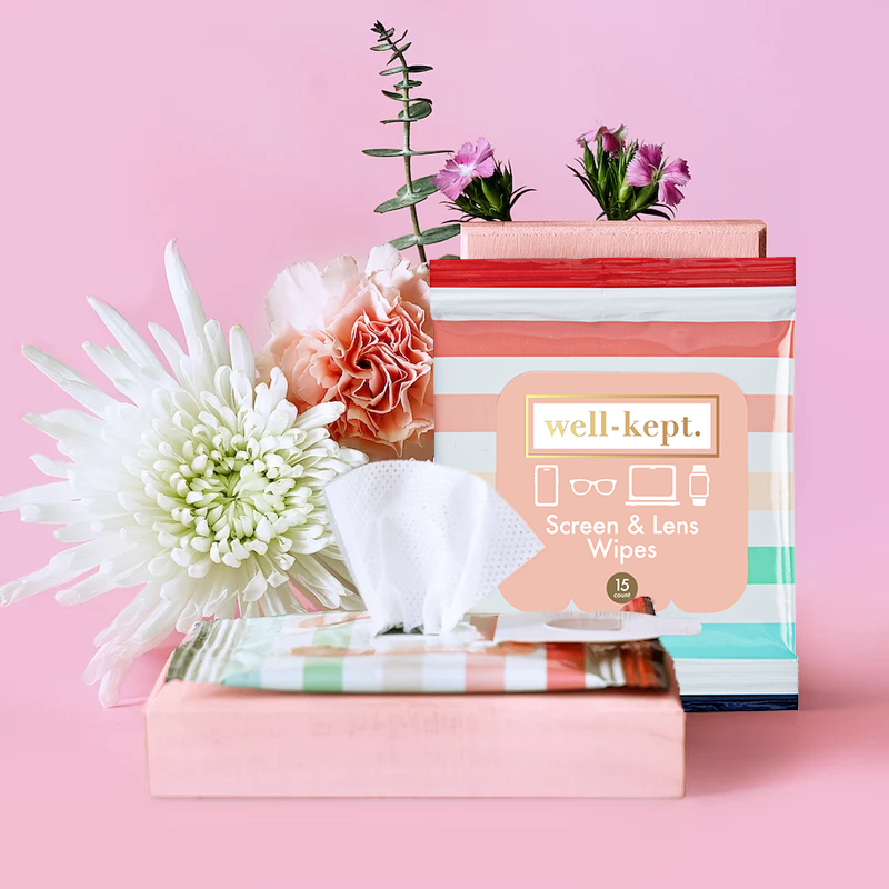Better Days striped Well-Kept screen and lens wipes pack on a pink background with flowers