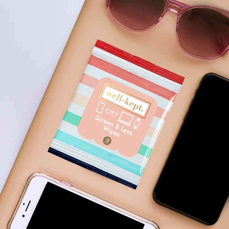 Better Days striped Well-Kept screen and lens wipes pack next to sunglasses and phones
